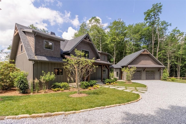 237 Glassy Rock Ln, Glenville, NC 28736 - view of front of home featuring a front yard, board and batten siding, roof with shingles, a garage, and a chimney