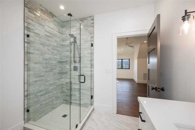 bathroom with an enclosed shower and vanity