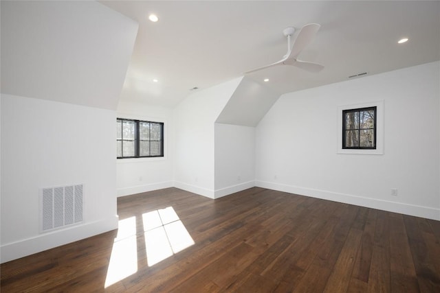 bonus room featuring vaulted ceiling, dark hardwood / wood-style floors, and ceiling fan