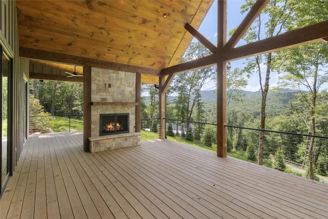237 Glassy Rock Ln, Glenville, NC 28736 - wooden deck with an outdoor stone fireplace and a mountain view