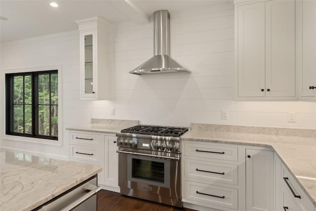 237 Glassy Rock Ln, Glenville, NC 28736 - kitchen with appliances with stainless steel finishes, wall chimney exhaust hood, white cabinets, glass insert cabinets, and light stone countertops