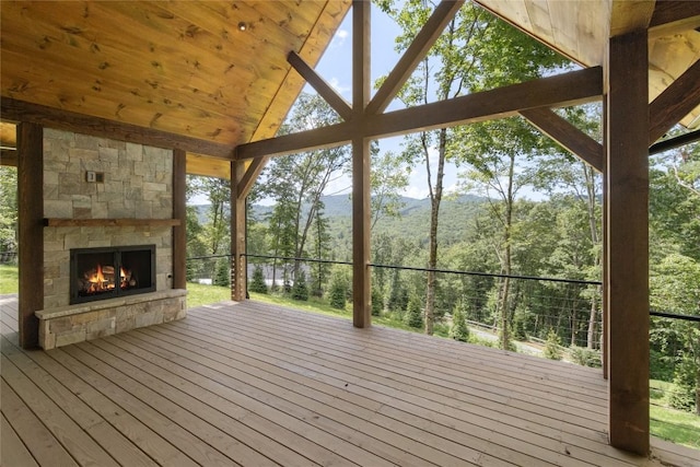 237 Glassy Rock Ln, Glenville, NC 28736 - deck featuring a stone fireplace and a mountain view