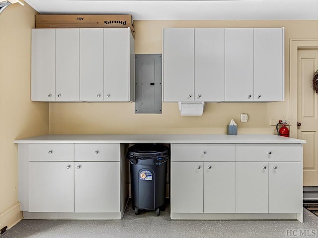 kitchen with white cabinetry and electric panel