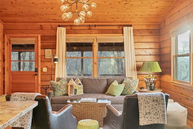 living room featuring wooden ceiling, vaulted ceiling, wooden walls, and an inviting chandelier