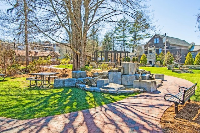 view of green lawn featuring a residential view