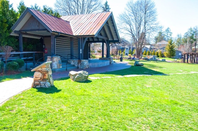 view of yard featuring covered porch