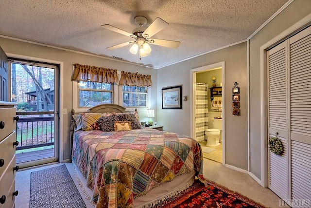 bedroom featuring a textured ceiling, access to exterior, ceiling fan, and a closet