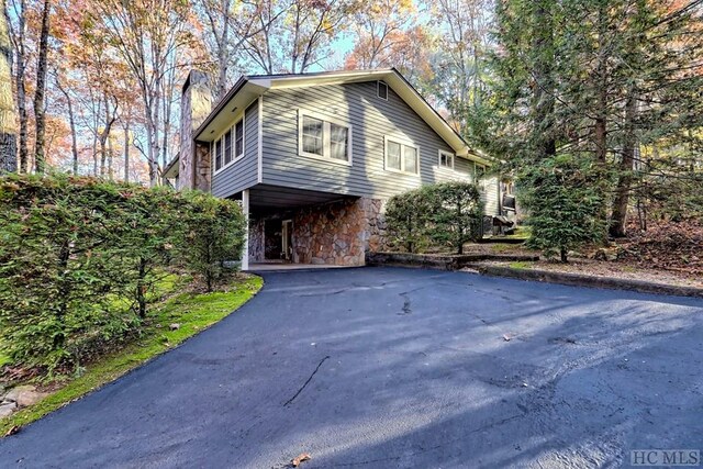 view of side of home featuring a carport