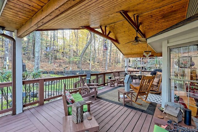 wooden terrace featuring ceiling fan