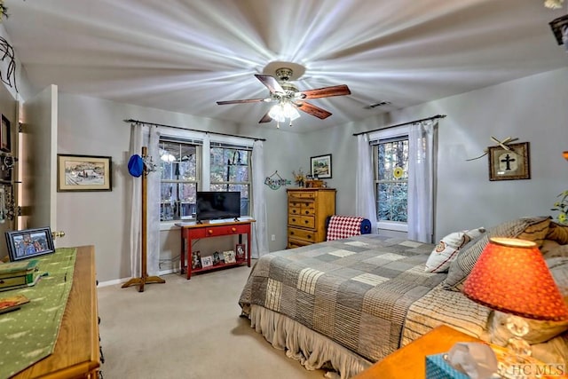 carpeted bedroom featuring ceiling fan