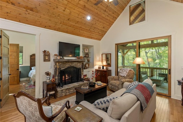 359 Outpost Trl, Glenville, NC 28736 - living area featuring high vaulted ceiling, a stone fireplace, light wood-style flooring, wooden ceiling, and a ceiling fan