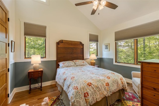 359 Outpost Trl, Glenville, NC 28736 - bedroom with wood finished floors, high vaulted ceiling, baseboards, and ceiling fan