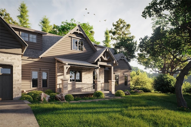 view of front facade featuring a shingled roof, a front yard, stone siding, and covered porch