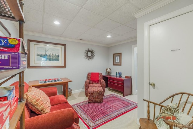 sitting room with baseboards, a drop ceiling, crown molding, and recessed lighting