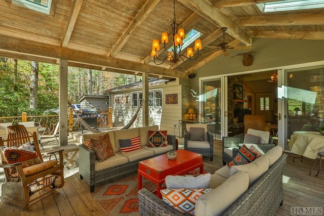 sunroom featuring lofted ceiling with beams, wood ceiling, and a notable chandelier