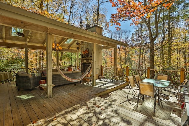 wooden terrace with outdoor dining area