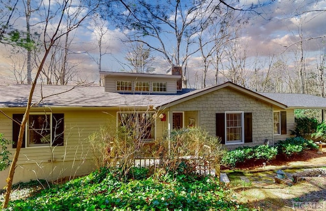 view of front of property with a chimney