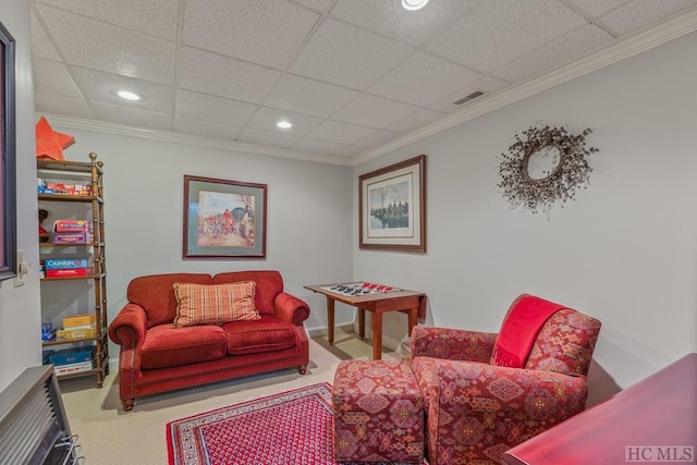 carpeted living area featuring crown molding, recessed lighting, visible vents, a drop ceiling, and baseboards