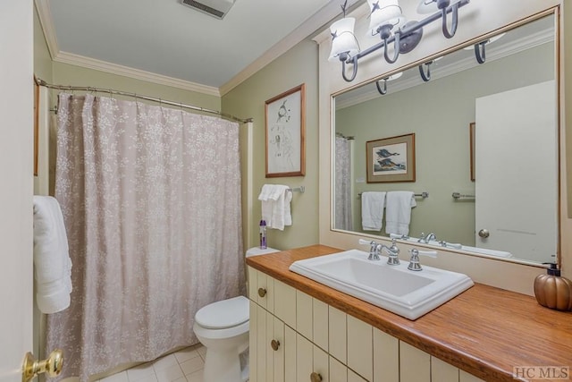 bathroom with visible vents, toilet, ornamental molding, vanity, and tile patterned floors