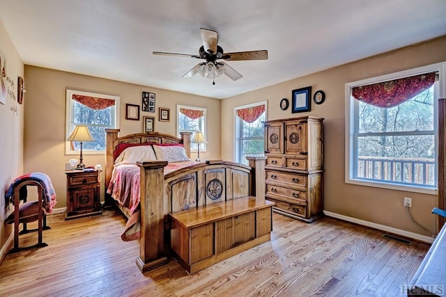 bedroom featuring light hardwood / wood-style flooring and ceiling fan