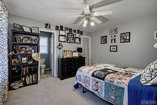 bedroom featuring ensuite bathroom, carpet, and ceiling fan