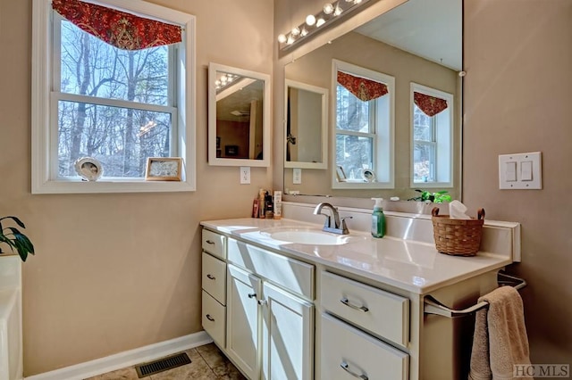 bathroom featuring tile patterned flooring and vanity