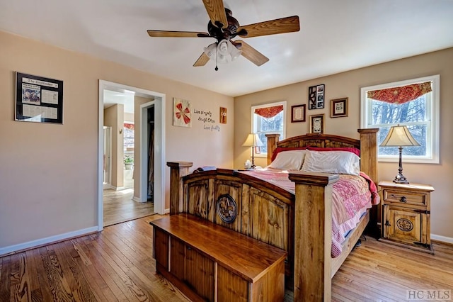 bedroom featuring ceiling fan and light hardwood / wood-style flooring