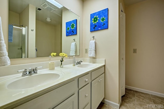 bathroom with tile patterned floors, vanity, and a shower with shower door