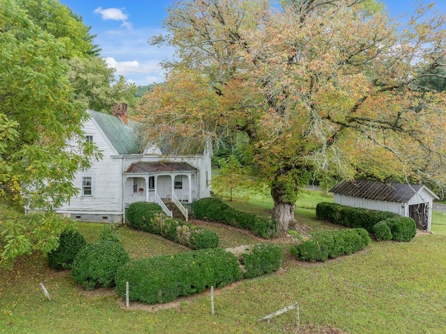 232 Dobson Rd, Franklin, NC 28734 - view of front of home with a porch, a chimney, a front lawn, an outdoor structure, and crawl space