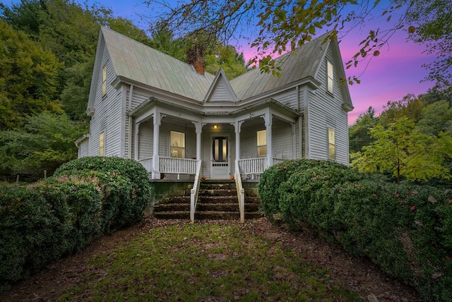 232 Dobson Rd, Franklin, NC 28734 - view of front of property with covered porch, a chimney, and metal roof