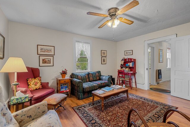 232 Dobson Rd, Franklin, NC 28734 - living area with light wood-style flooring, ceiling fan, and heating unit