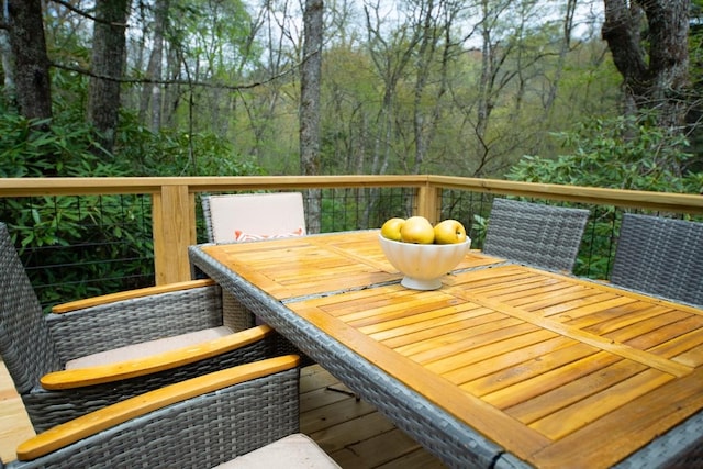 wooden terrace with outdoor dining space