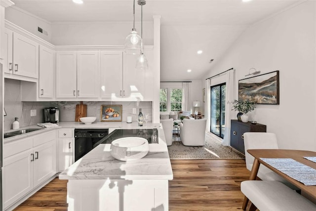 kitchen with black dishwasher, white cabinetry, light wood finished floors, decorative backsplash, and recessed lighting