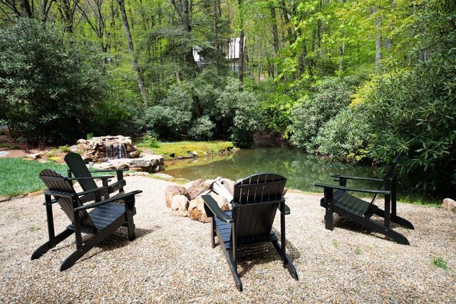 view of patio / terrace with a view of trees