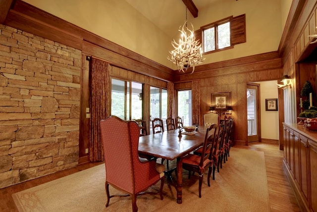 1747 Cold Mountain Rd, Lake Toxaway, NC 28747 - dining area featuring high vaulted ceiling, a chandelier, light wood-style flooring, healthy amount of natural light, and beam ceiling