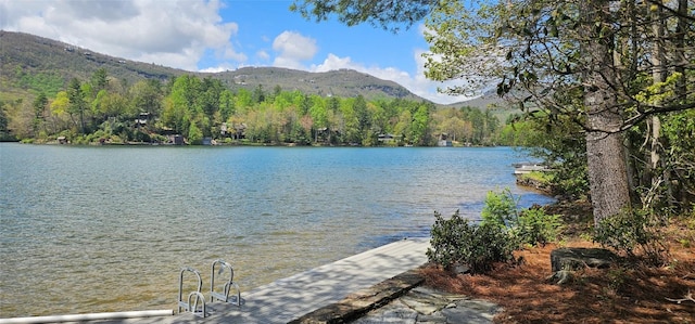 1747 Cold Mountain Rd, Lake Toxaway, NC 28747 - water view featuring a mountainous background, a dock, and a heavily wooded area