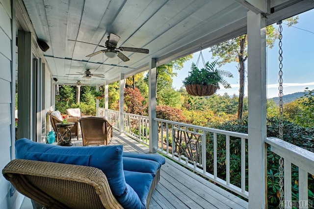 wooden deck with ceiling fan