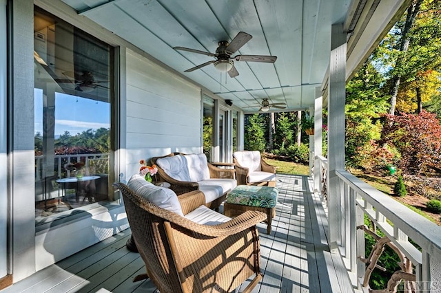 deck with an outdoor living space and ceiling fan