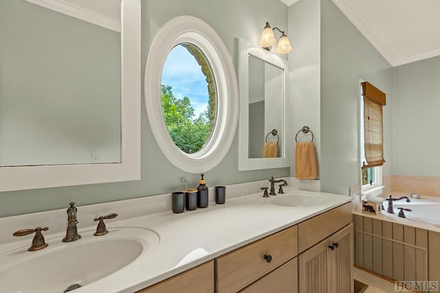 bathroom featuring crown molding, a tub to relax in, and vanity