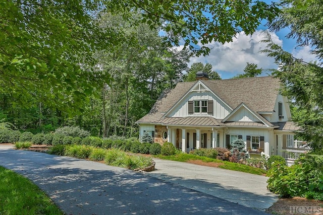 23 Drystack Way, Cashiers, NC 28717 - view of front of property with a standing seam roof, a chimney, a porch, a metal roof, and board and batten siding