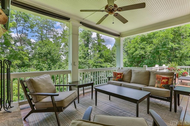 sunroom with a wealth of natural light and ceiling fan