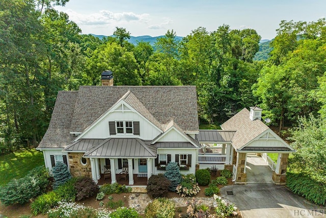 23 Drystack Way, Cashiers, NC 28717 - view of front of home with a porch, a standing seam roof, a shingled roof, and a carport
