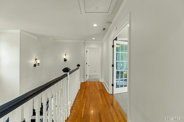 corridor with crown molding and wood-type flooring