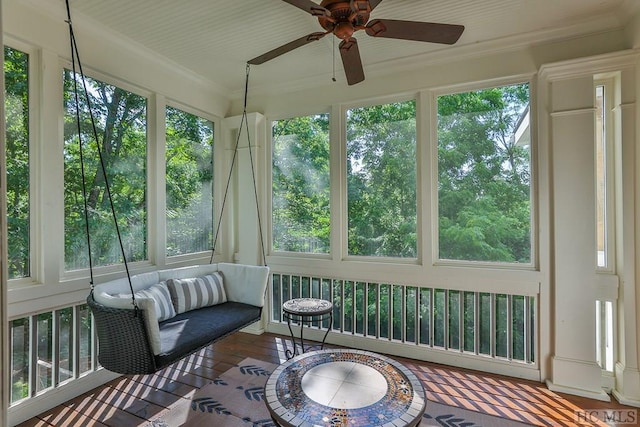 sunroom with ceiling fan