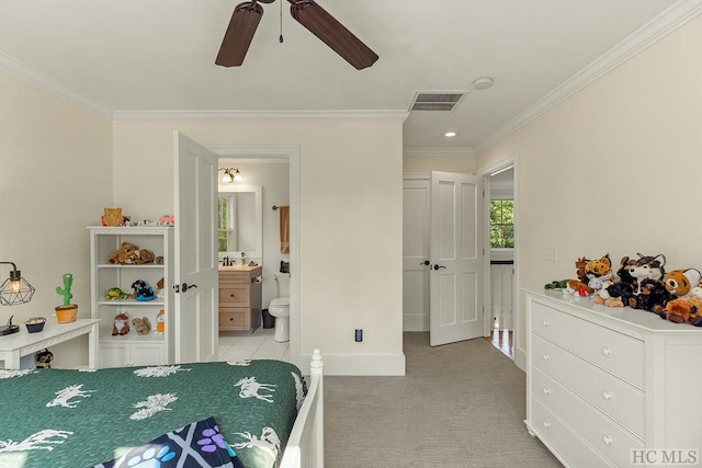 bedroom with ceiling fan, ornamental molding, light carpet, and ensuite bath