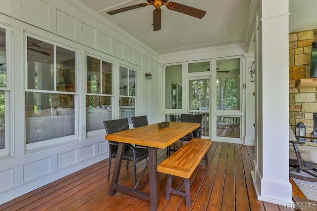 sunroom / solarium with ceiling fan