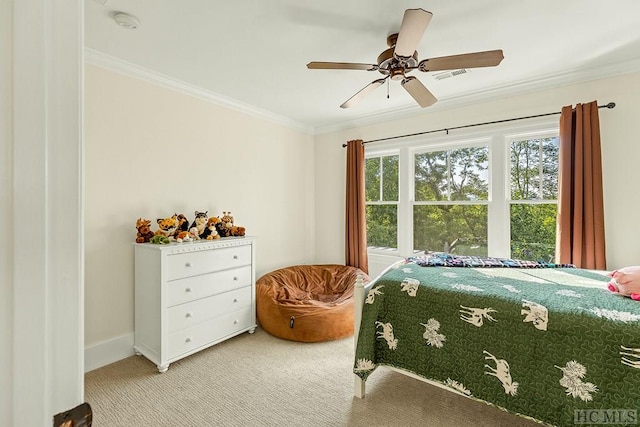 bedroom featuring crown molding, ceiling fan, and carpet