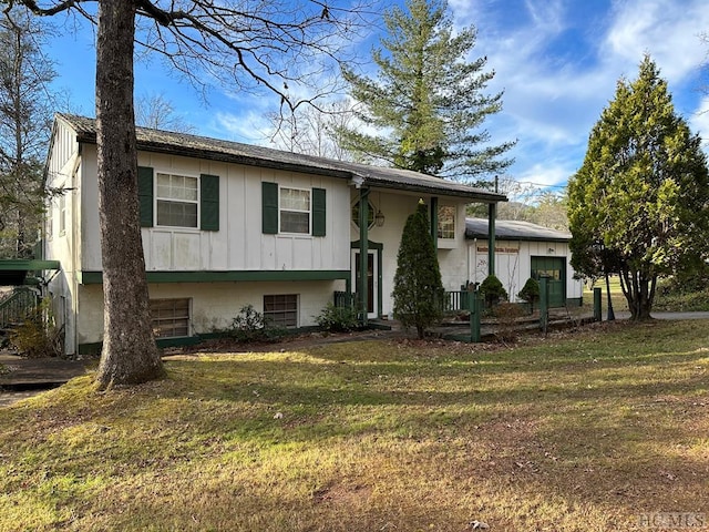 bi-level home with a front lawn