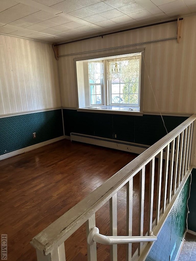 empty room featuring hardwood / wood-style flooring