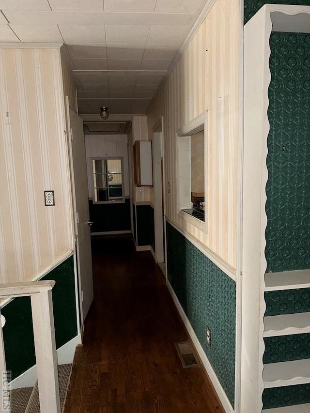 corridor featuring dark hardwood / wood-style floors